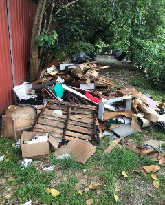 Photo showing dismantled furniture and other household items illegally disposed of at a secluded alley along Defu Lane 1.